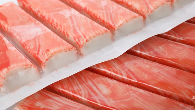 Closeup view on packs of fresh crab sticks