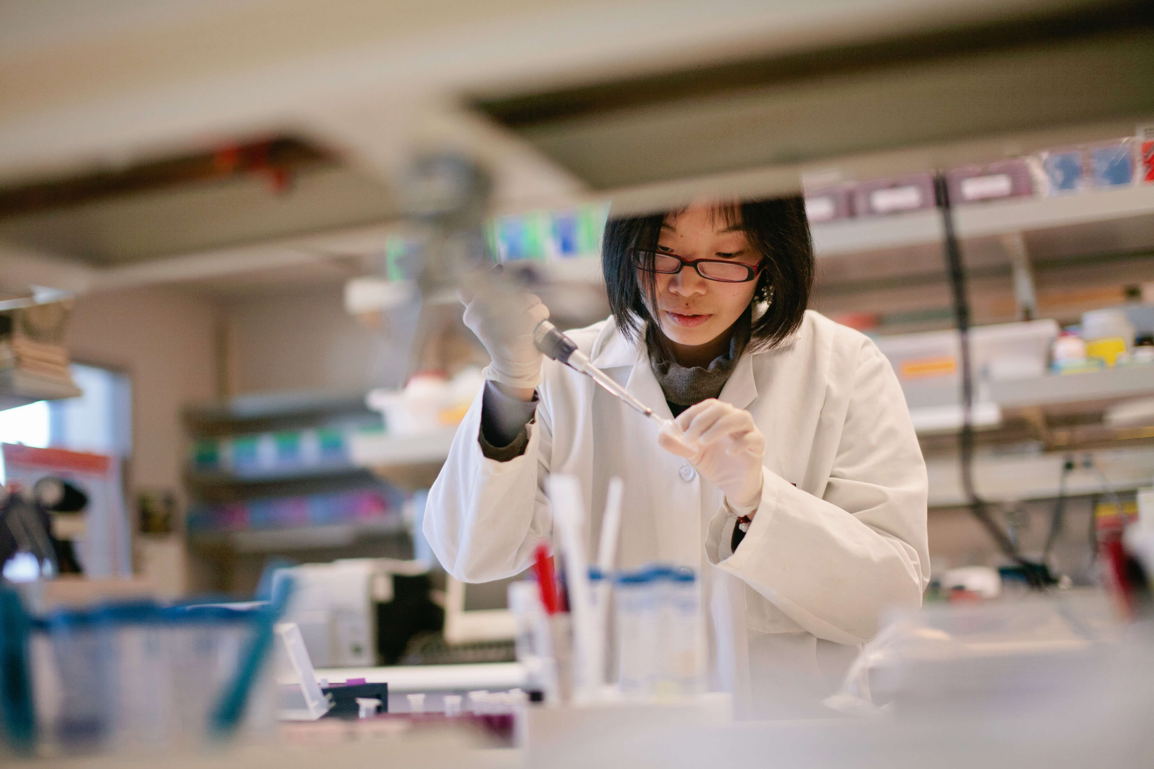 Woman Scientist Pipetting at a Biomedical Laboratory